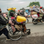 Democratic Republic of the Congo, just outside of Goma, North Kivu province, 26 January 2025

In the photo: displaced people leaving Kanyaruchinya IDP camp, running away from FARDC (Armed Forces of the Democratic Republic of the Congo / French: Forces armées de la république démocratique du Congo) and M23 (March 23 Movement) fighting.