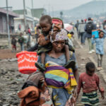 Democratic Republic of the Congo, just outside of Goma, North Kivu province, 26 January 2025

In the photo: displaced people leaving Kanyaruchinya IDP camp, running away from FARDC (Armed Forces of the Democratic Republic of the Congo / French: Forces armées de la république démocratique du Congo) and M23 (March 23 Movement) fighting.
